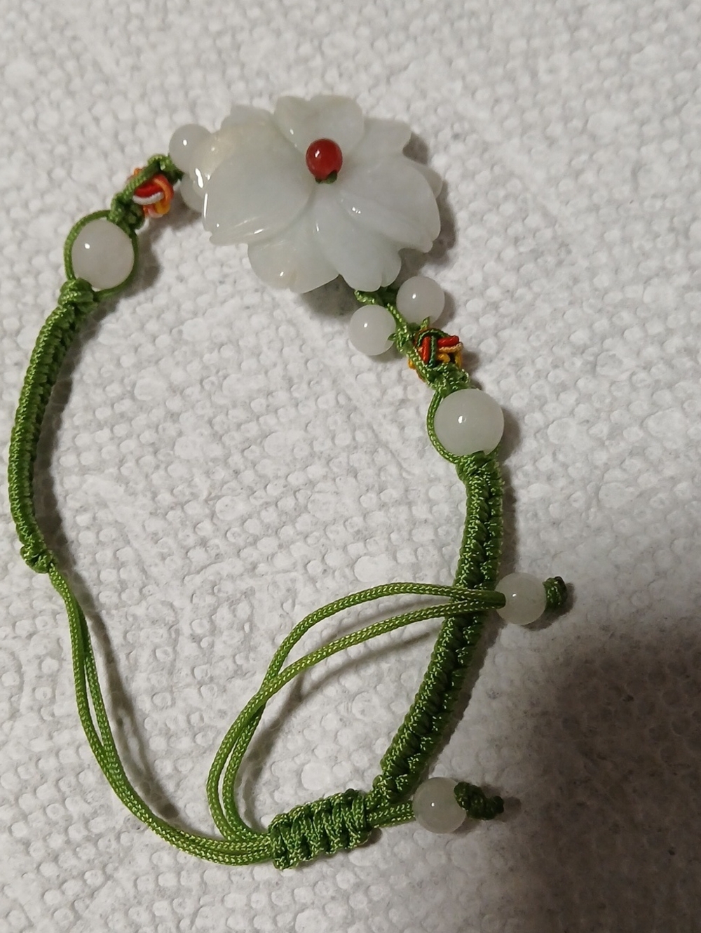 Green Cord Bracelet with White Flower Jade Accent